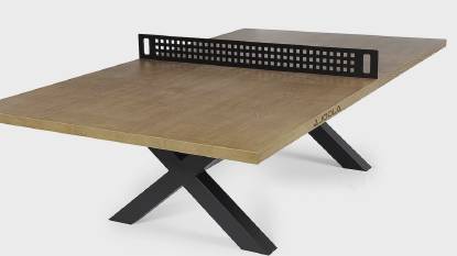 Outdoor ping pong table with oak wood look surface and steel frame.